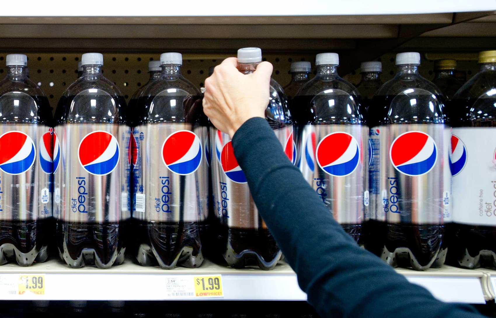 A woman grabs a bottle of Diet Pepsi in Atlanta, Georgia.